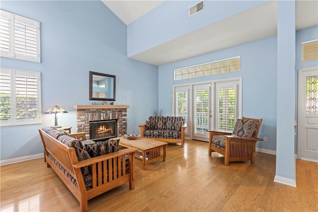 27118 Highlands Ln, Valencia, CA 91354 - living room with a towering ceiling, wood finished floors, baseboards, and a fireplace