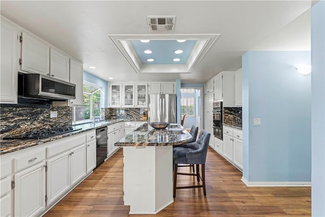 27118 Highlands Ln, Valencia, CA 91354 - kitchen with stainless steel appliances, a warming drawer, a breakfast bar, plenty of natural light, and recessed lighting