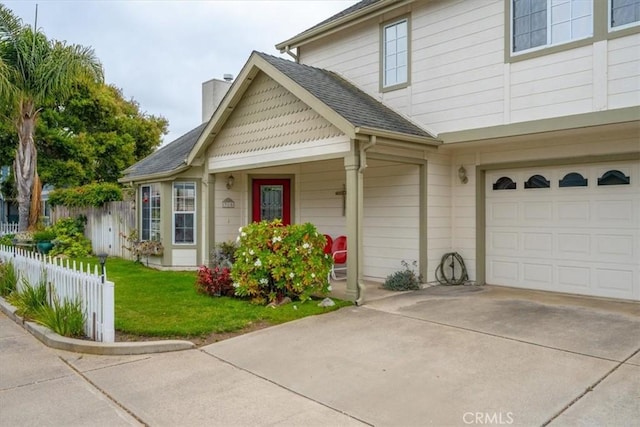 315 Alder St, Arroyo Grande, CA 93420 - view of front of house featuring driveway, a chimney, a front yard, fence, and an attached garage