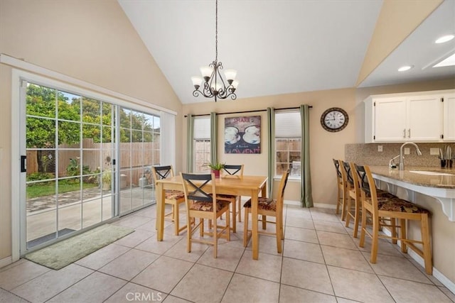 315 Alder St, Arroyo Grande, CA 93420 - dining area featuring an inviting chandelier, recessed lighting, baseboards, light tile patterned floors, and vaulted ceiling