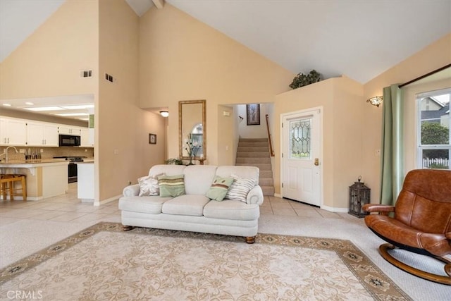 315 Alder St, Arroyo Grande, CA 93420 - living room featuring visible vents, light tile patterned floors, high vaulted ceiling, baseboards, and stairs