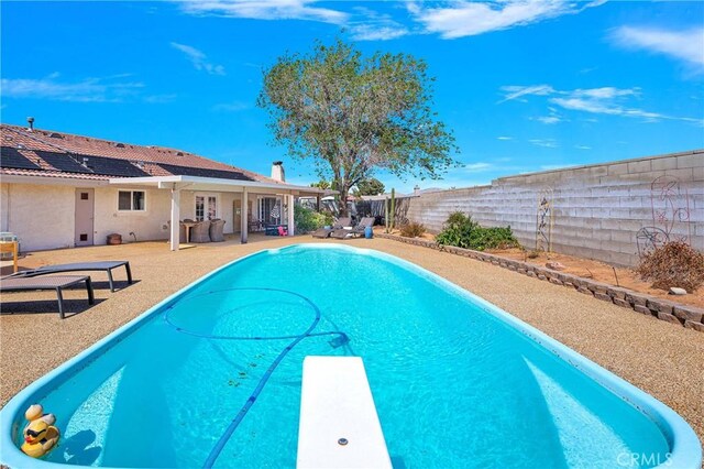 view of pool featuring a fenced in pool, a patio, and a fenced backyard