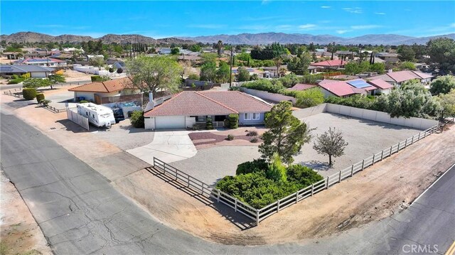 drone / aerial view featuring a mountain view and a residential view