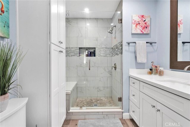 full bathroom with vanity, toilet, recessed lighting, and a stall shower