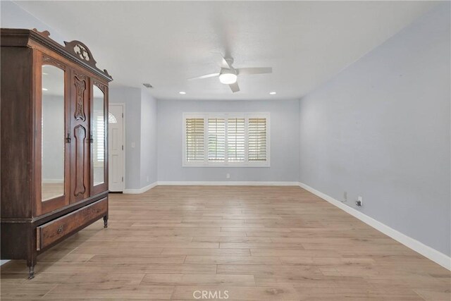 interior space with recessed lighting, ceiling fan, baseboards, and light wood-type flooring