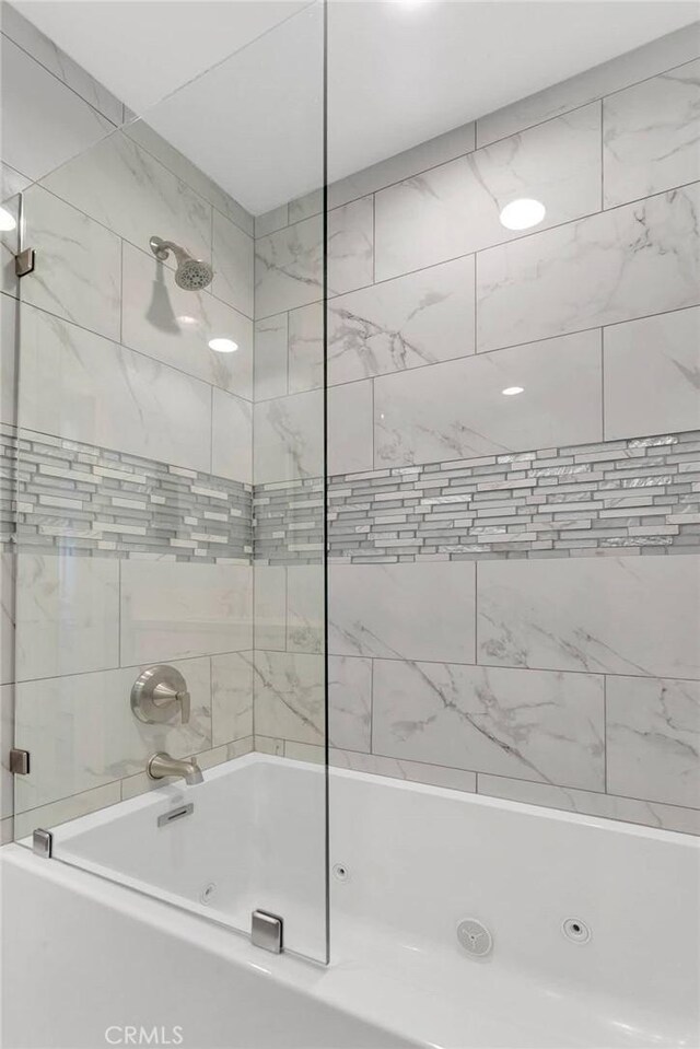 bathroom featuring a combined bath / shower with jetted tub