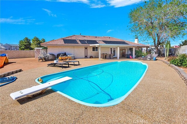 view of swimming pool featuring a fenced backyard, a fenced in pool, and a patio area