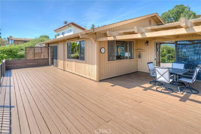 deck with outdoor dining space