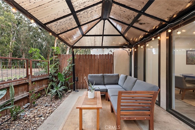 view of patio with fence, a gazebo, and outdoor lounge area