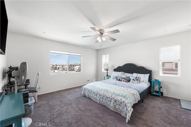 carpeted bedroom with baseboards and ceiling fan