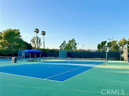 view of sport court featuring fence and community basketball court