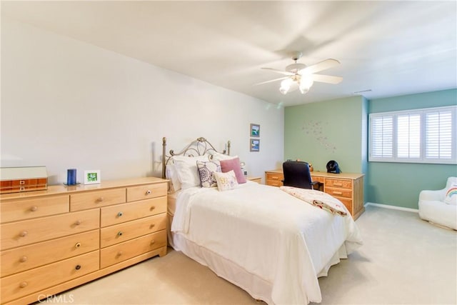 bedroom featuring a ceiling fan and light colored carpet