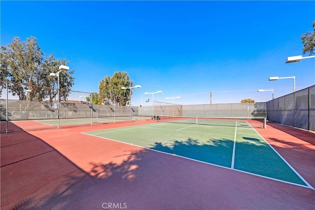view of sport court with fence and community basketball court