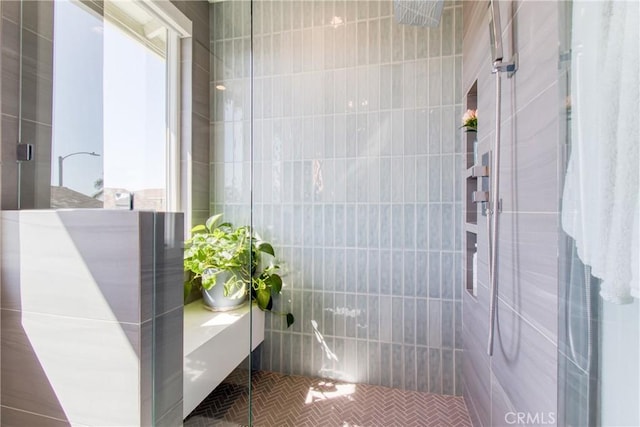 full bathroom with tiled shower