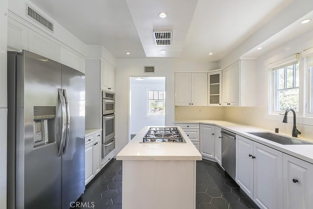 3325 Alana Dr, Sherman Oaks, CA 91403 - kitchen featuring white cabinetry, appliances with stainless steel finishes, a sink, and visible vents