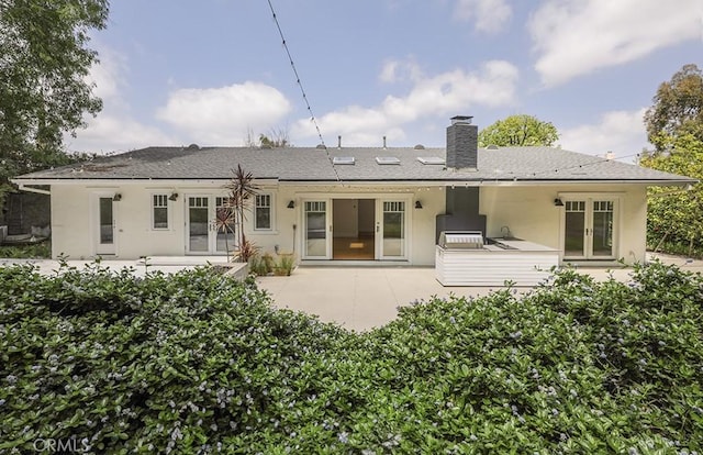 3325 Alana Dr, Sherman Oaks, CA 91403 - back of property with a patio, french doors, a chimney, and stucco siding