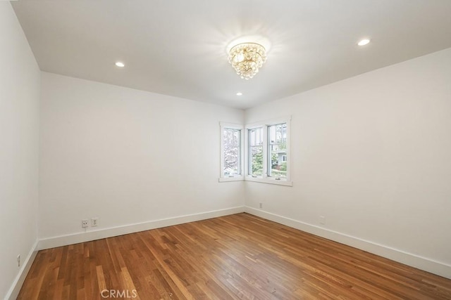 3325 Alana Dr, Sherman Oaks, CA 91403 - unfurnished room featuring baseboards, recessed lighting, wood finished floors, and a notable chandelier