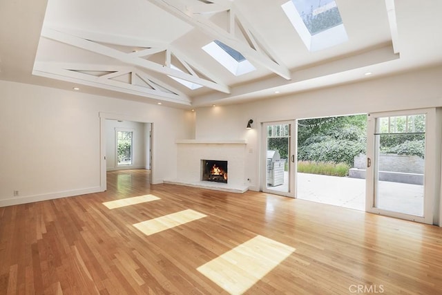 3325 Alana Dr, Sherman Oaks, CA 91403 - unfurnished living room with plenty of natural light, light wood-type flooring, and beam ceiling