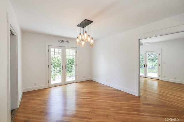 3325 Alana Dr, Sherman Oaks, CA 91403 - empty room featuring plenty of natural light, french doors, and light wood-type flooring