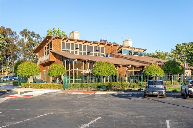 22435 Silver Spur, Lake Forest, CA 92630 - view of property with uncovered parking and fence