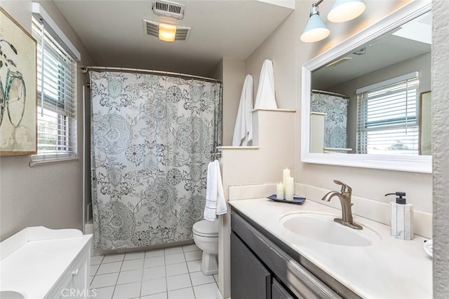 22435 Silver Spur, Lake Forest, CA 92630 - full bathroom with vanity, toilet, tile patterned floors, a wealth of natural light, and visible vents