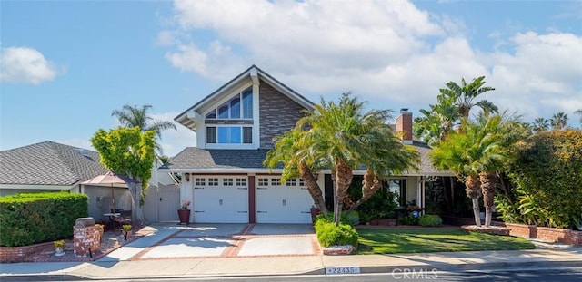 22435 Silver Spur, Lake Forest, CA 92630 - view of front of home featuring an attached garage, roof with shingles, and concrete driveway