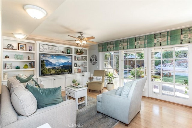 22435 Silver Spur, Lake Forest, CA 92630 - living area featuring crown molding, a ceiling fan, and light wood finished floors