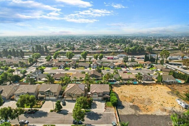 birds eye view of property with a residential view
