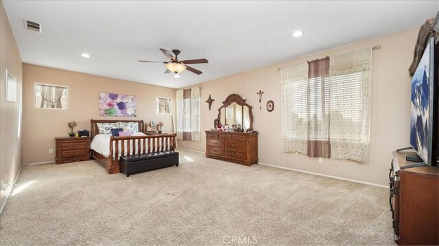 bedroom featuring baseboards, carpet, and multiple windows