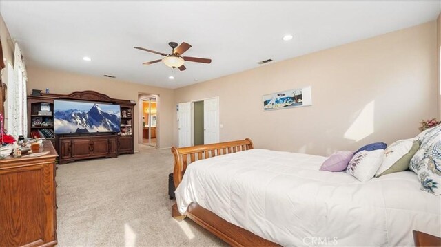 bedroom featuring visible vents, recessed lighting, ceiling fan, and light colored carpet