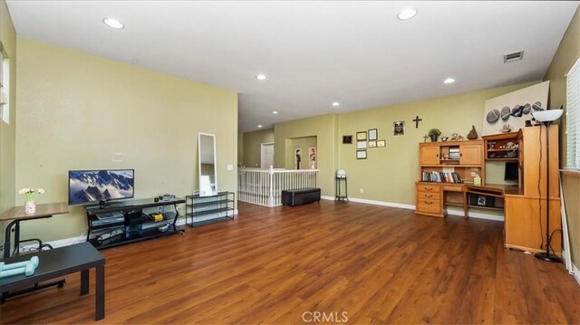 office space featuring visible vents, recessed lighting, baseboards, and wood finished floors