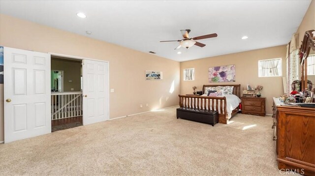 bedroom with carpet floors, recessed lighting, and visible vents