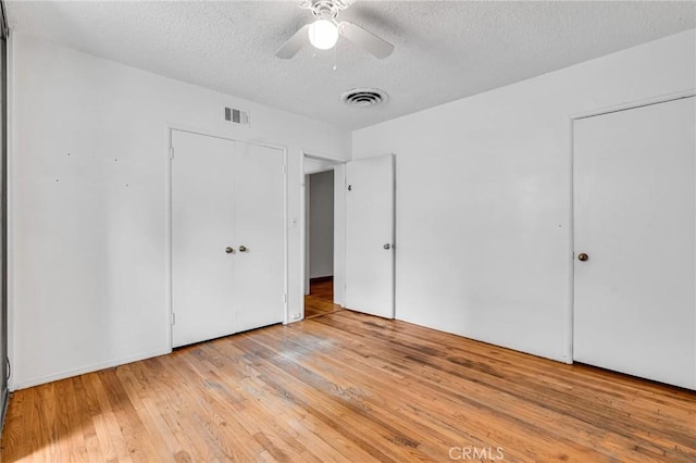7038 Mclennan Ave, Lake Balboa, CA 91406 - unfurnished bedroom featuring a ceiling fan, a textured ceiling, visible vents, and light wood finished floors