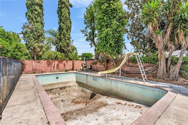 7038 Mclennan Ave, Lake Balboa, CA 91406 - view of pool with a water slide, a fenced backyard, and a fenced in pool