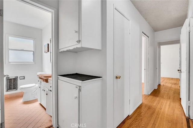7038 Mclennan Ave, Lake Balboa, CA 91406 - corridor featuring baseboards, visible vents, and light wood finished floors