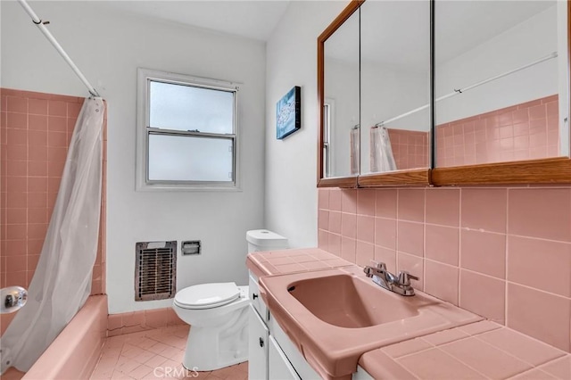7038 Mclennan Ave, Lake Balboa, CA 91406 - full bathroom featuring tasteful backsplash, shower / tub combo, vanity, toilet, and heating unit