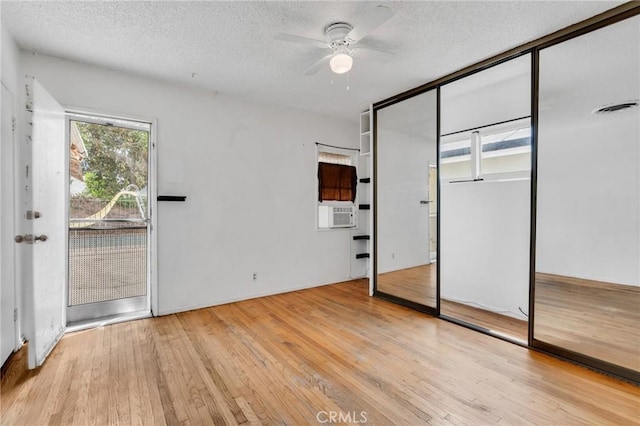 7038 Mclennan Ave, Lake Balboa, CA 91406 - unfurnished bedroom with access to outside, a textured ceiling, visible vents, and hardwood / wood-style flooring