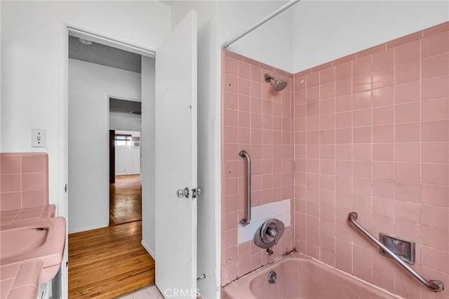 7038 Mclennan Ave, Lake Balboa, CA 91406 - full bathroom with baseboards, tub / shower combination, wood finished floors, and vanity