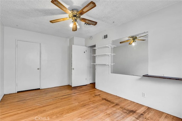 7038 Mclennan Ave, Lake Balboa, CA 91406 - unfurnished living room featuring a ceiling fan, a textured ceiling, visible vents, and light wood finished floors