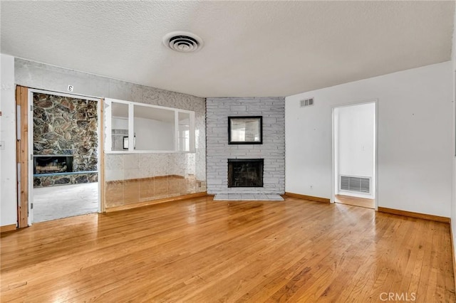 7038 Mclennan Ave, Lake Balboa, CA 91406 - unfurnished living room featuring visible vents and a fireplace