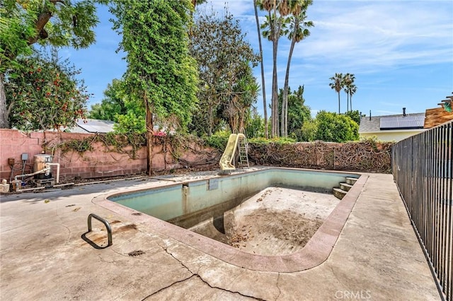 7038 Mclennan Ave, Lake Balboa, CA 91406 - view of swimming pool with a fenced in pool, a fenced backyard, a patio area, and a water slide