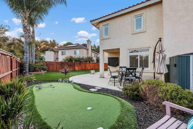 view of yard with a patio and a fenced backyard