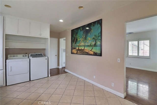 clothes washing area with baseboards, washer and clothes dryer, light tile patterned flooring, and recessed lighting