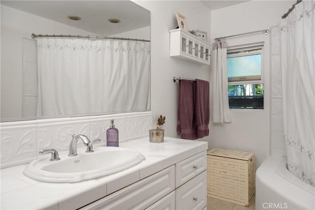 full bathroom featuring vanity and shower / bath combo