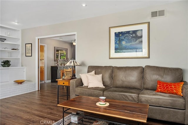 living room featuring recessed lighting, visible vents, and wood finished floors