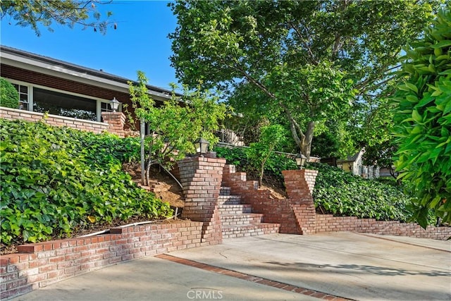 entrance to property featuring a patio