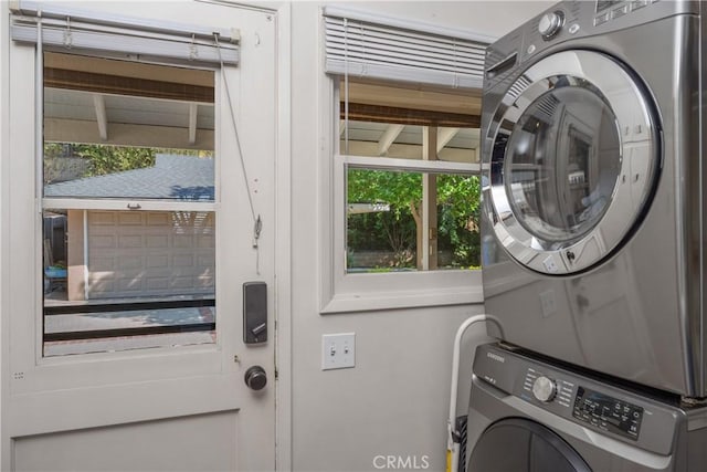 laundry area with laundry area and stacked washing maching and dryer