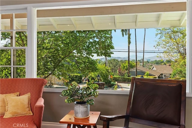 sunroom / solarium with a mountain view