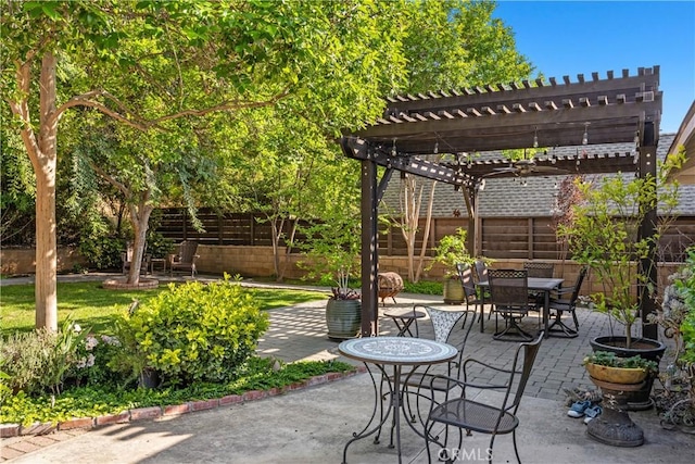 view of patio with a pergola, a fenced backyard, and outdoor dining space