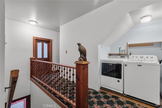 laundry room with laundry area, wood finished floors, and washer and dryer
